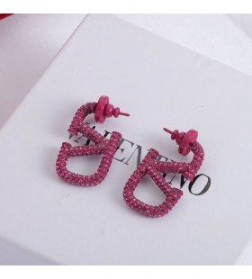 Valentino Mion VLogo Síniú Cluaise Miotail Le Criostail Corcra